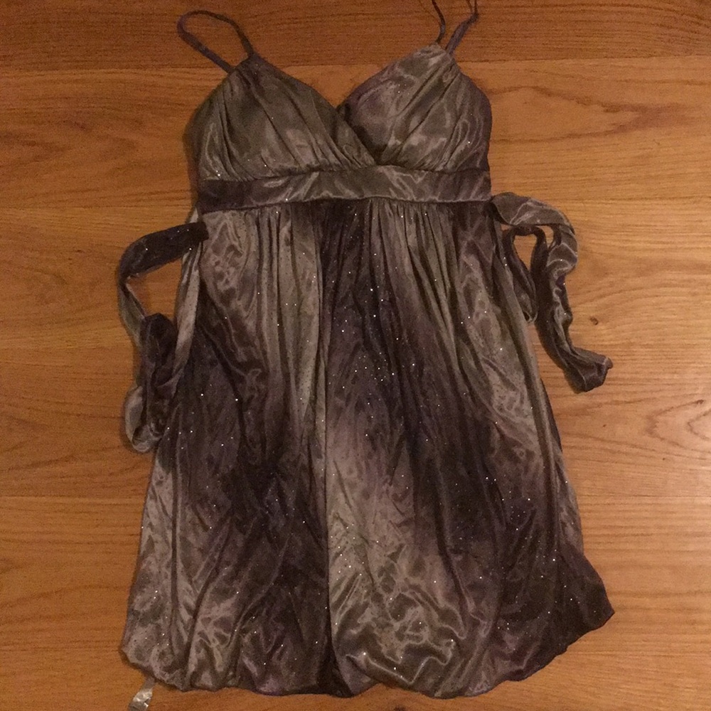 This is a small grey/brownish short length dress.